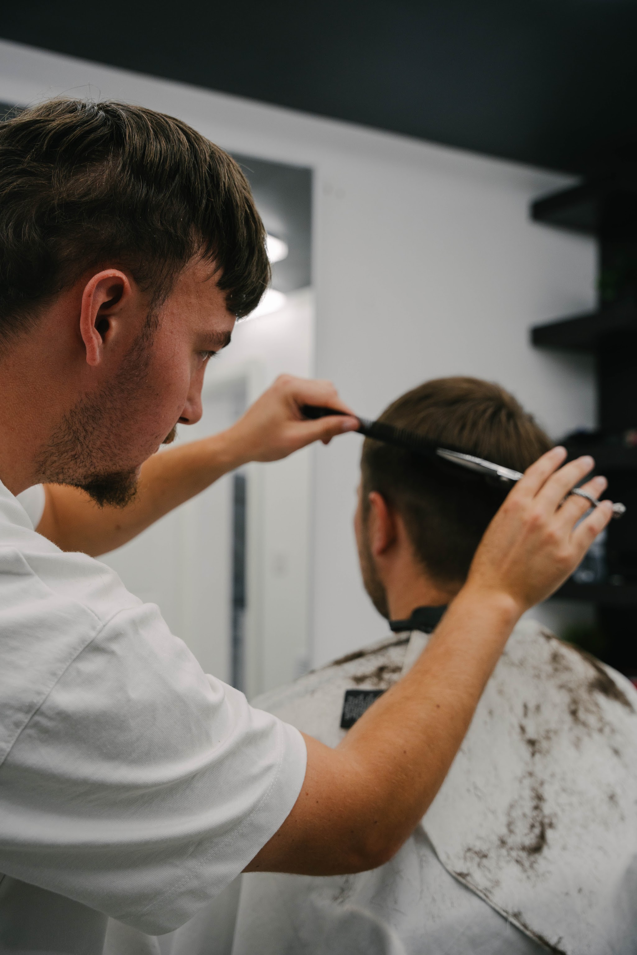 Scissor work on the top of a client's hair
