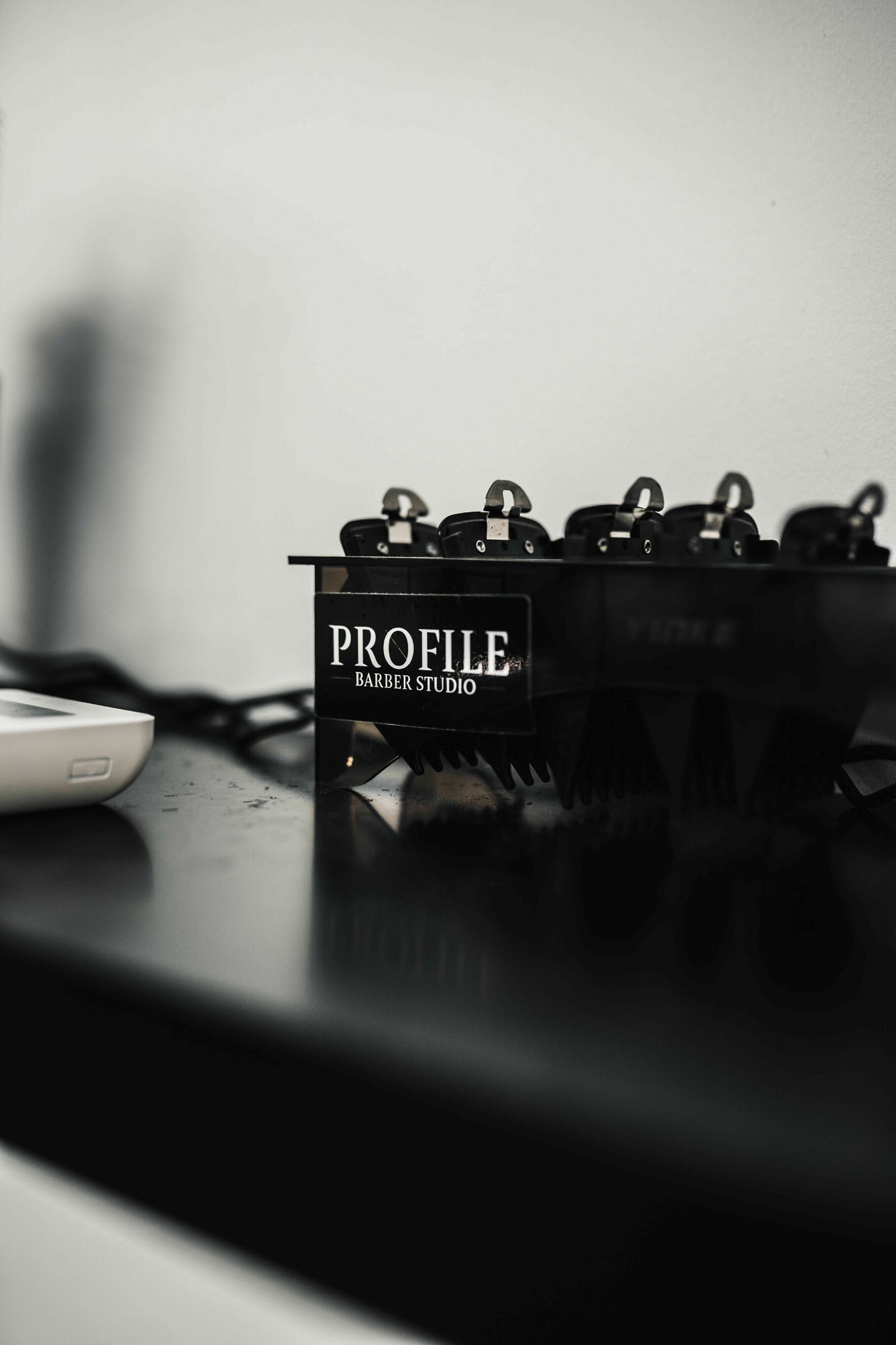 Clippers resting in a Profile-branded stand on the counter